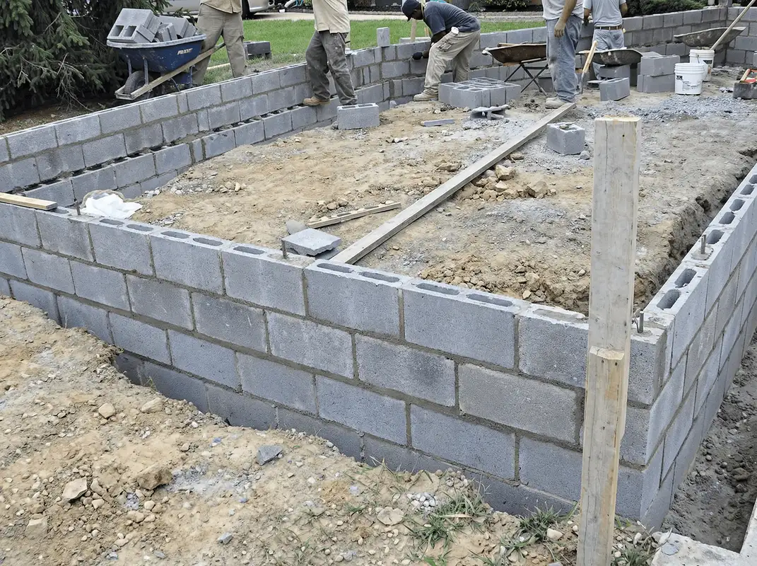 Professionals building a foundation with blocks in Kansas City, MO