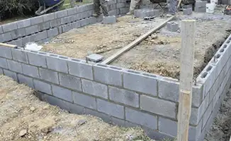Professionals building a foundation with blocks in Kansas City, MO