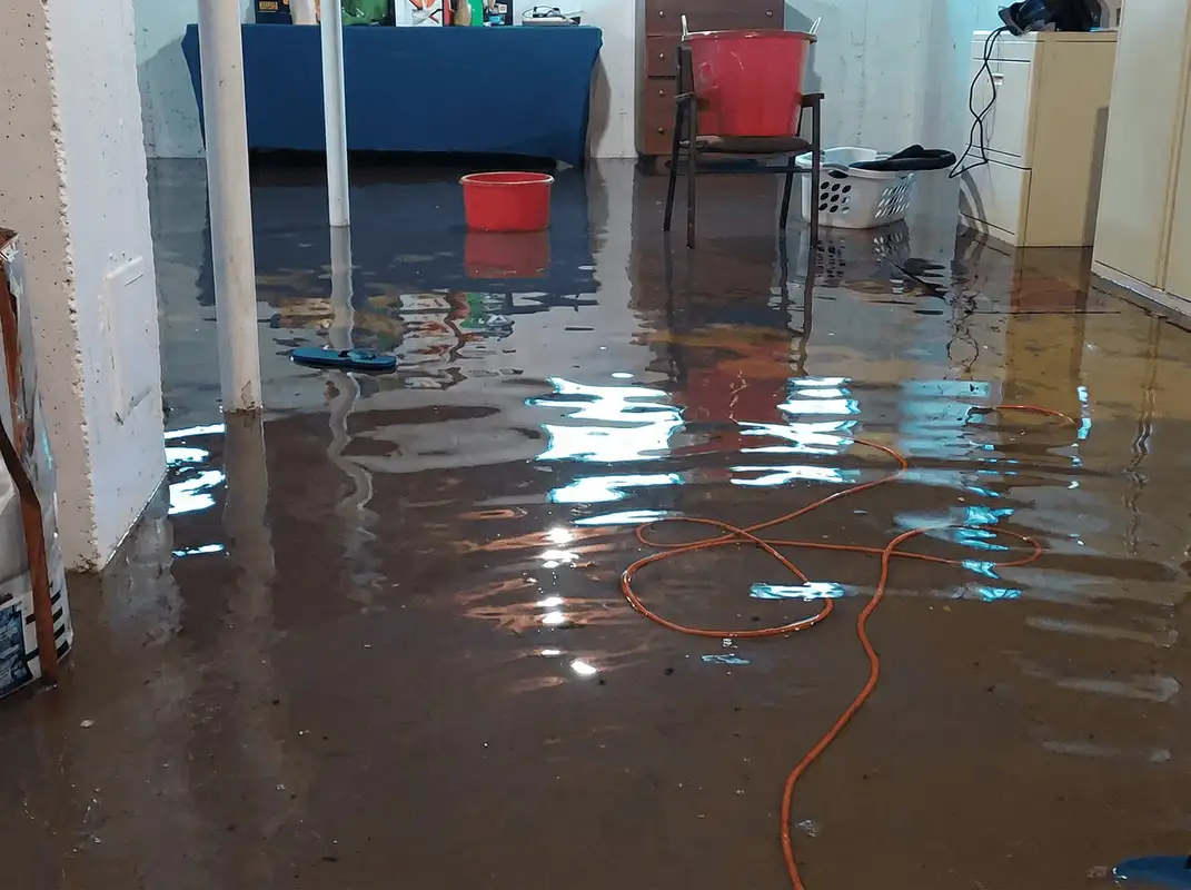 Basement with boiler, cabinets and washing machine completely flooded in Kansas City, MO